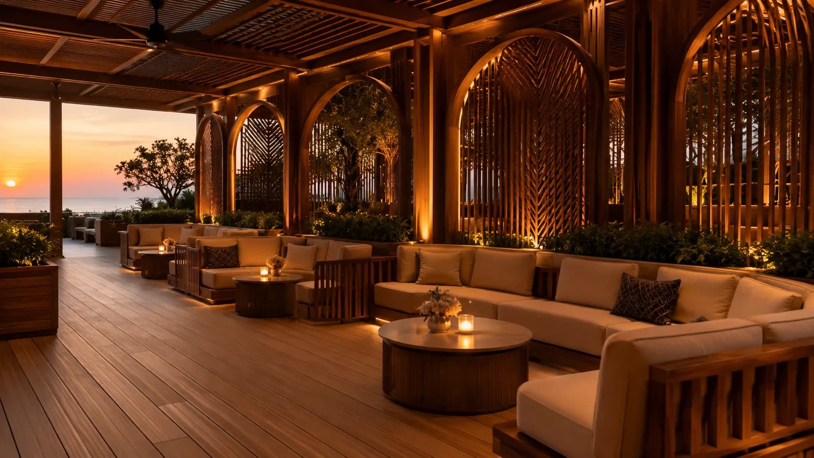 An elegant event lounge with crafted-wood banquettes on warm decking