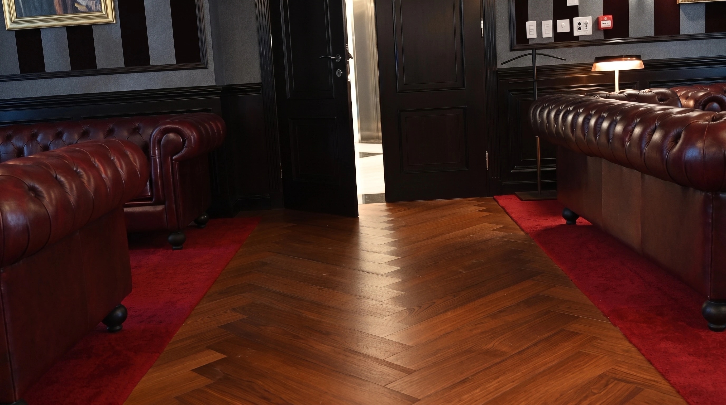 Herringbone parquet carried through a panelled threshold