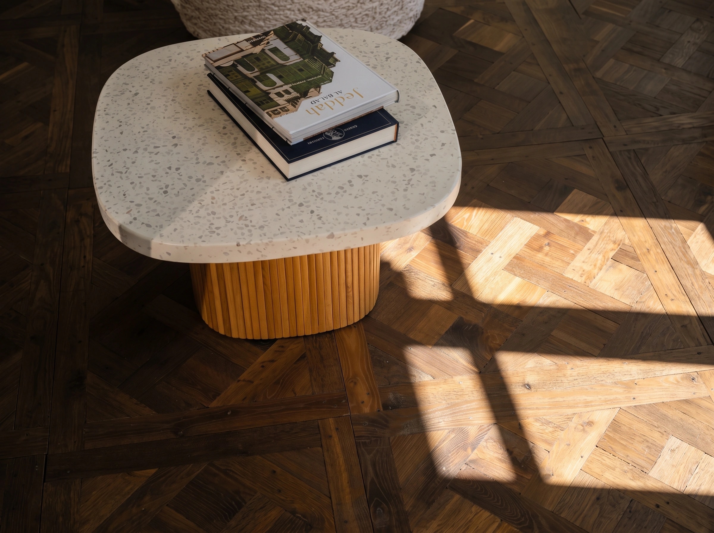 HARO parquet with a terrazzo table in warm daylight