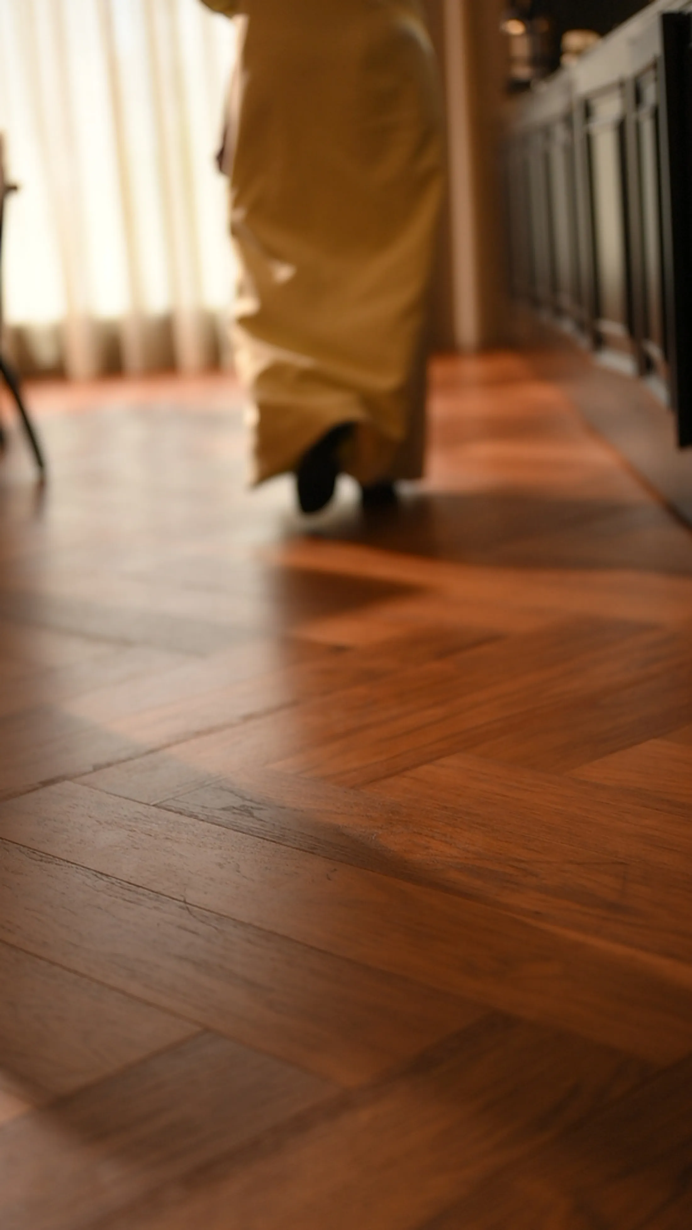 Golden herringbone oak corridor at dusk