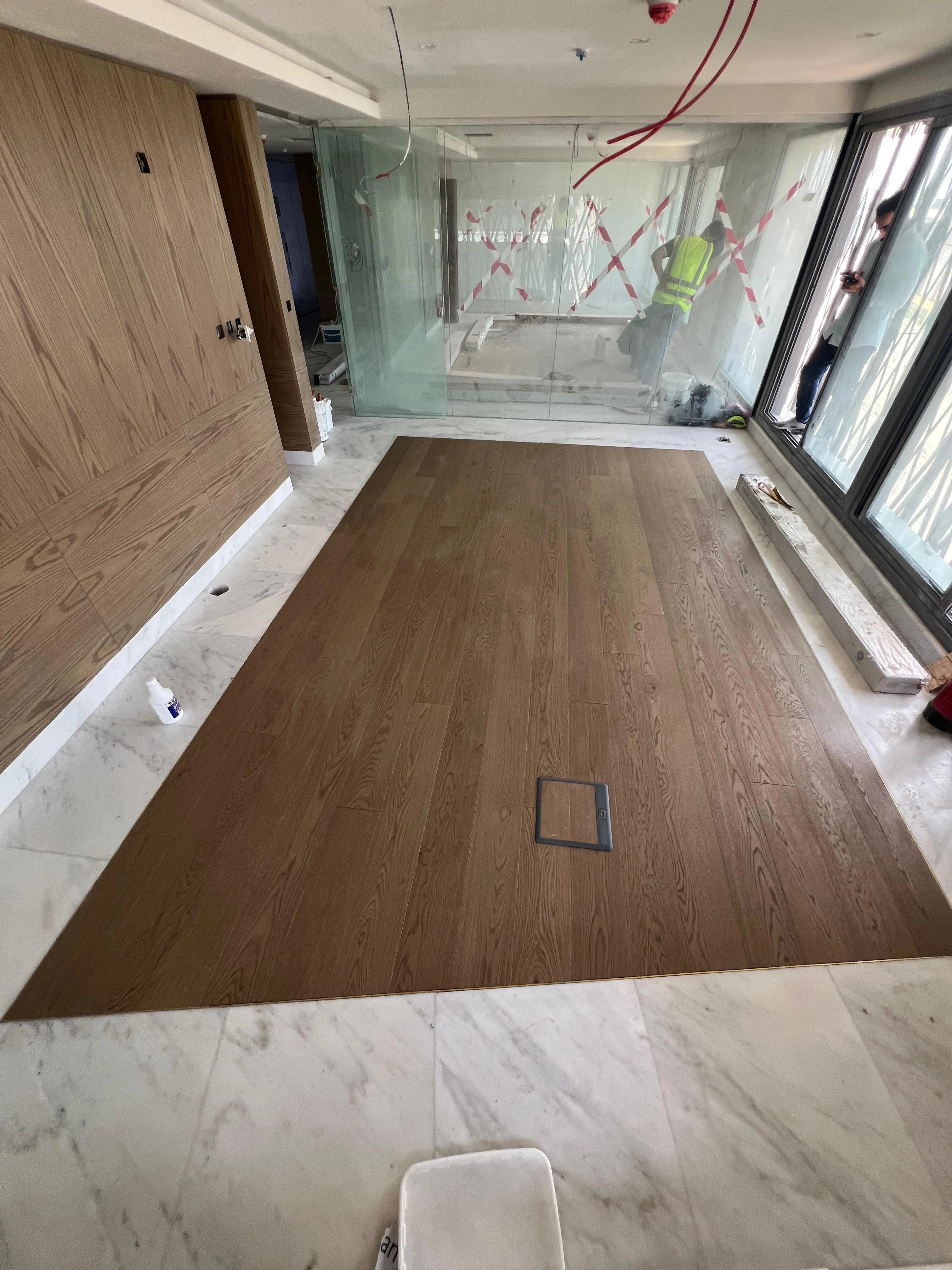 The completed oak field held inside its marble border