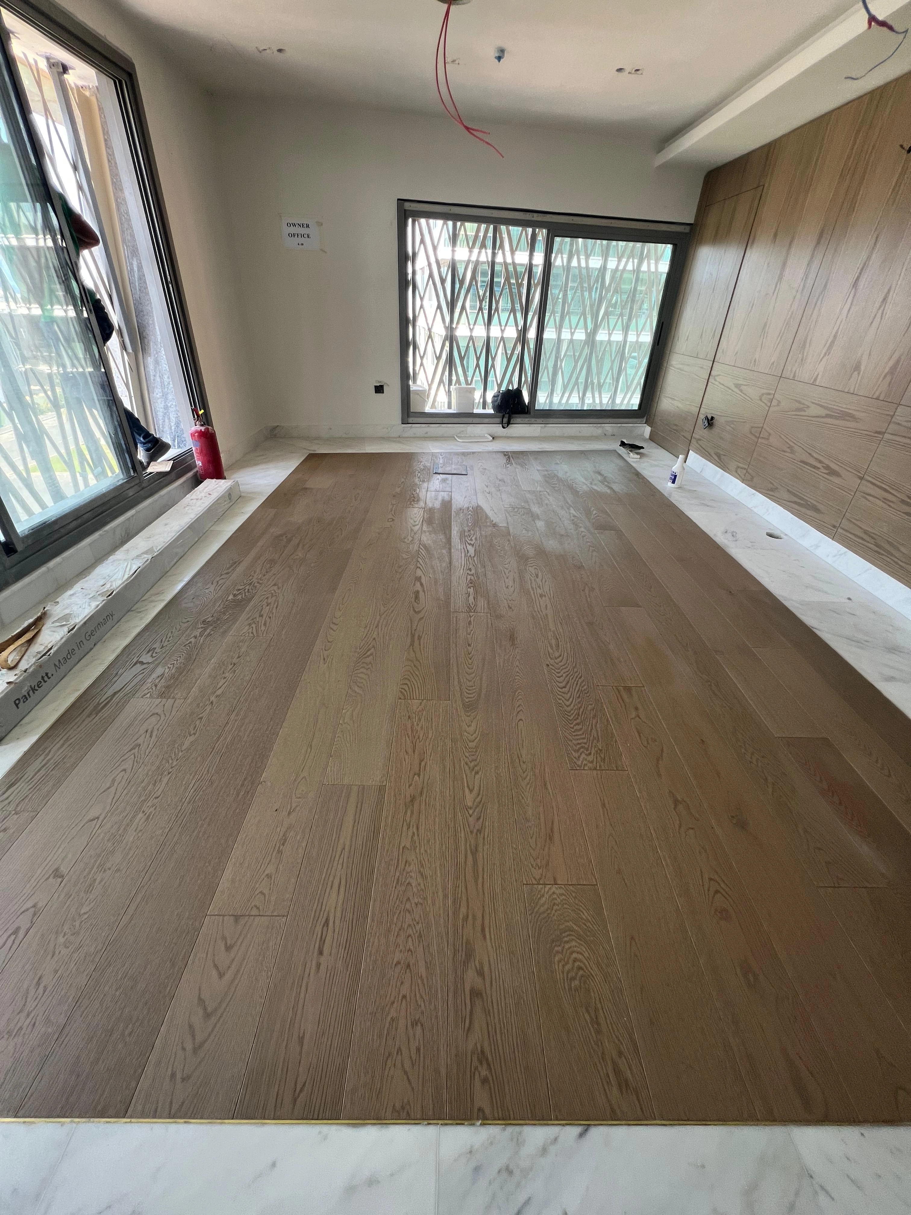 Wide oak boards running along the room's principal sightline