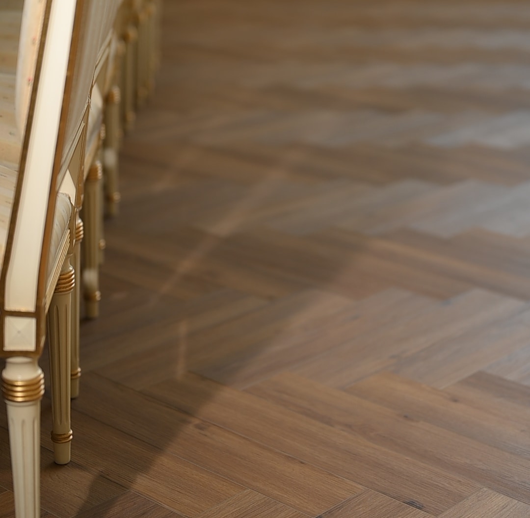 Herringbone oak carrying the depth of a long room