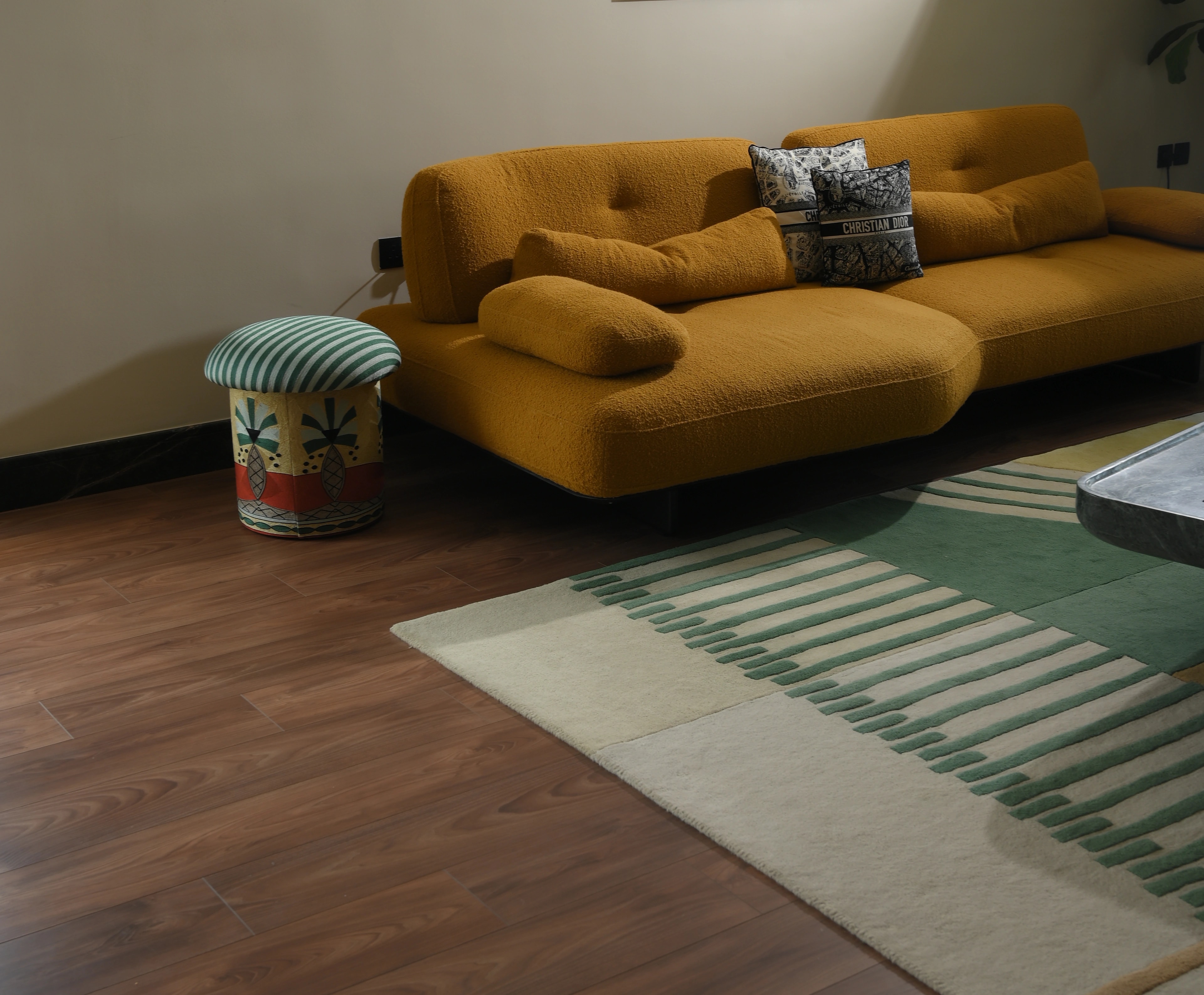 A living room floored in warm herringbone oak