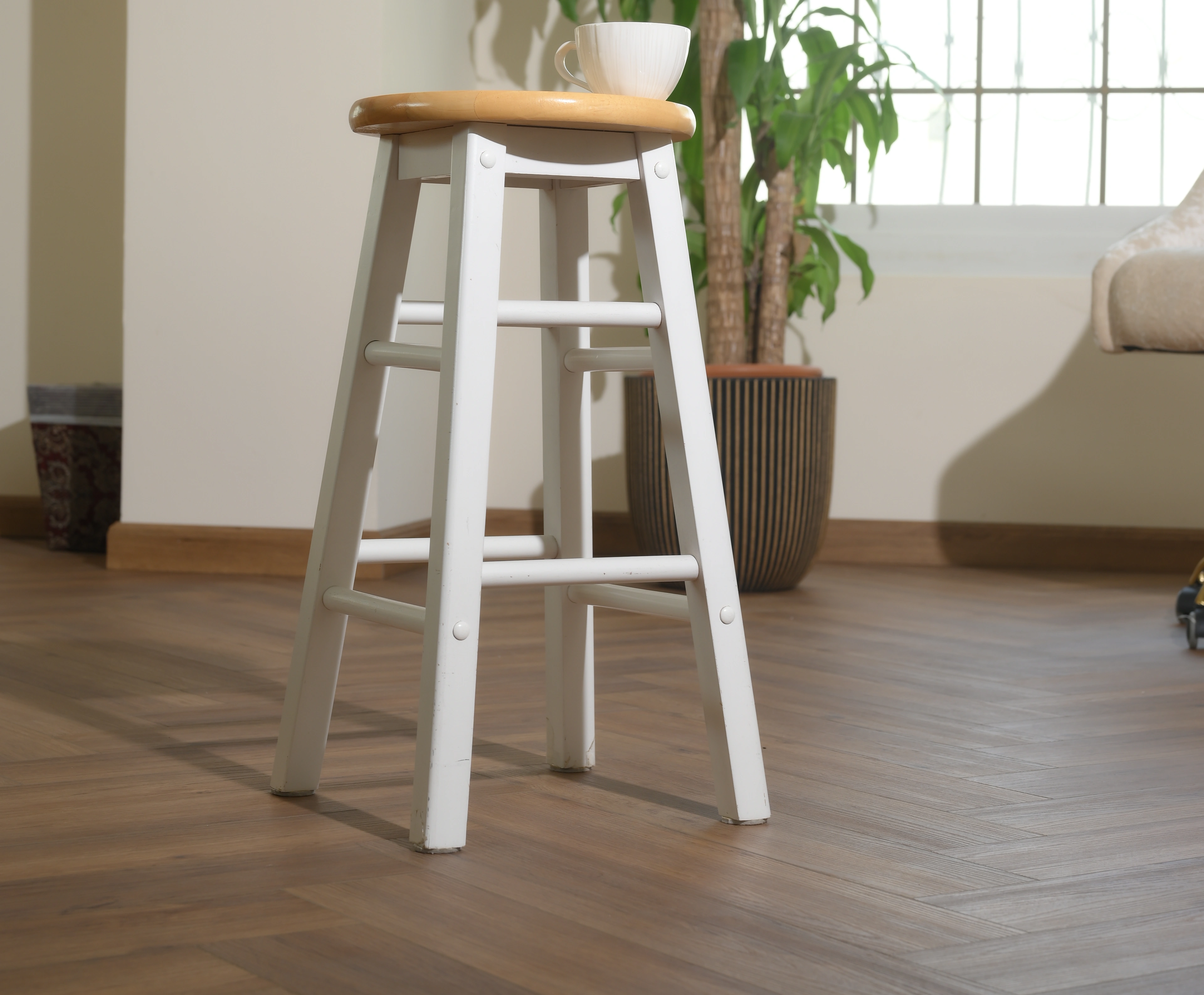 Herringbone oak in a daylit corner of the residence