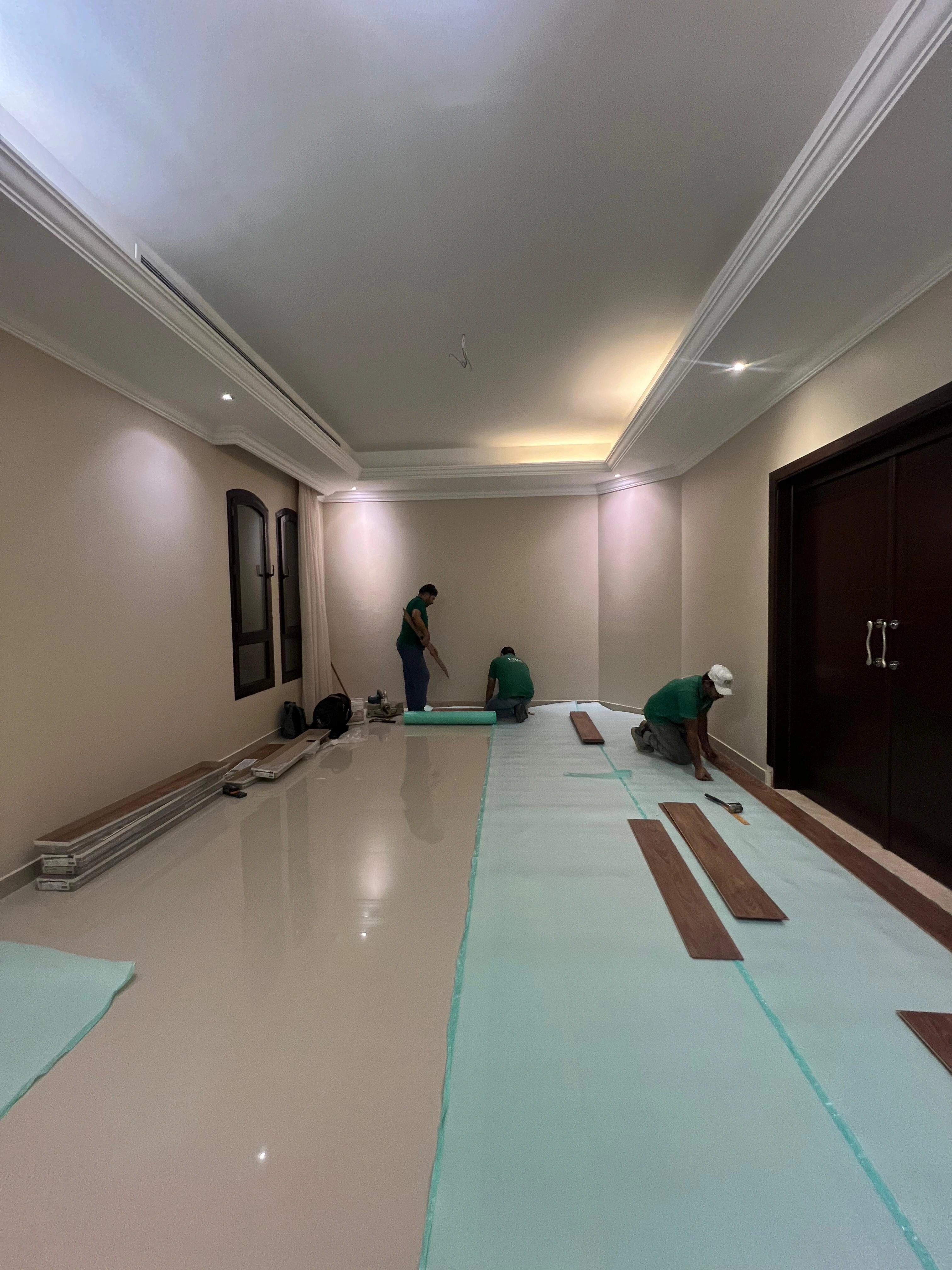Elite's team protecting the stone floor before the oak installation